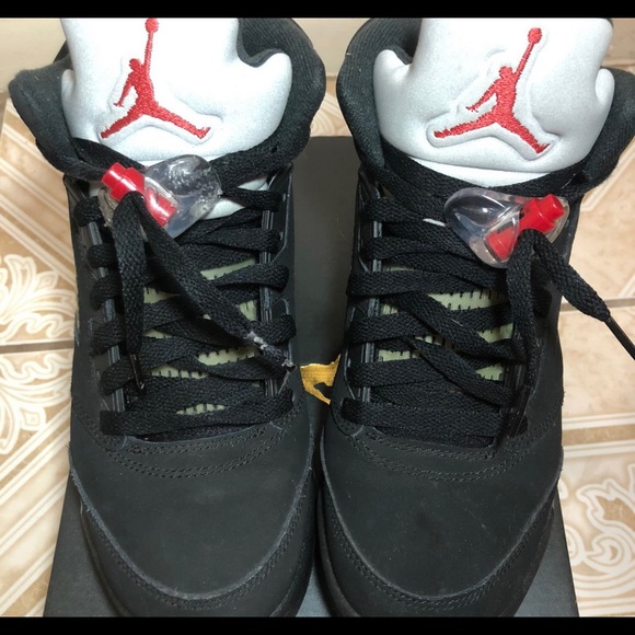 Black metallic Jordan 4s